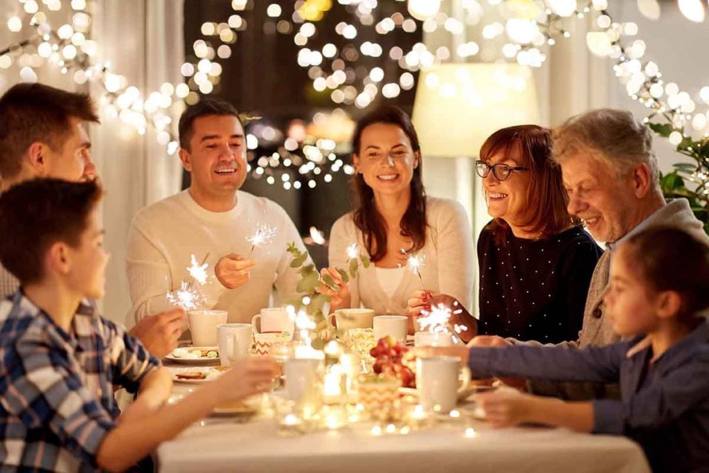 family sitting around a table enjoying a sober holiday