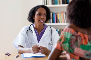 woman talking to her doctor about a Vivitrol MAT program